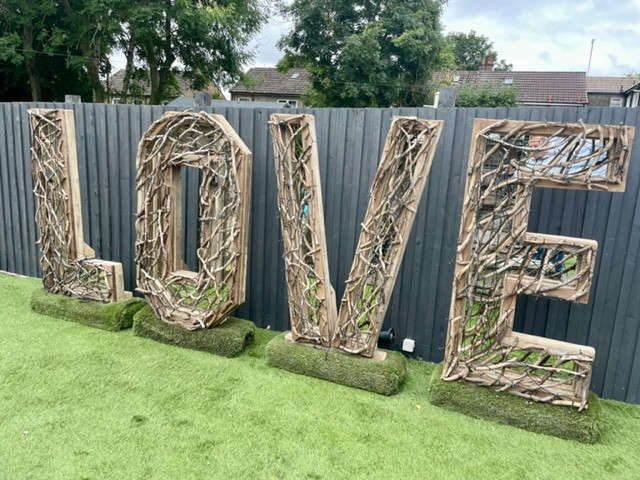 illuminated driftwood love letters