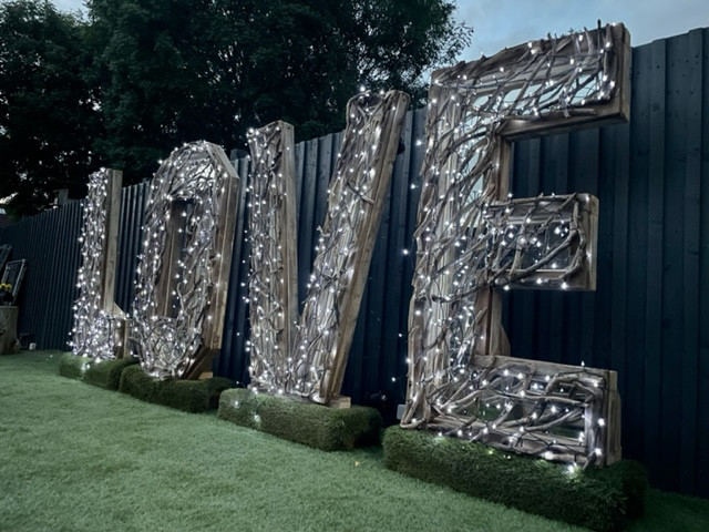 illuminated driftwood love letters